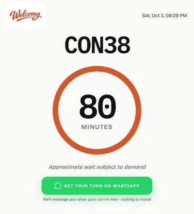 A visitor's real ticket screen: their number, the estimated wait and the WhatsApp opt-in.